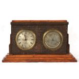A Victorian oak cased barometer thermometer, the silver dials signed 'J. Woolley & Co.', 47cms (18.