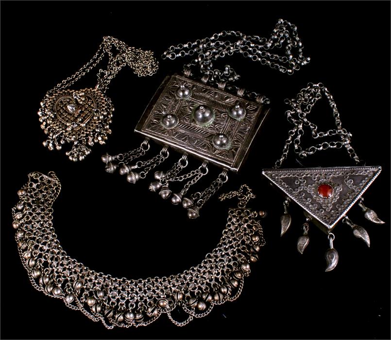 A box containing large Eastern/ Indian white metal jewellery items including bell ankle bracelet.