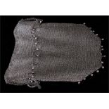 A silver (tested) early 20th century chain mesh drawstring evening bag with hanging ball decoration.