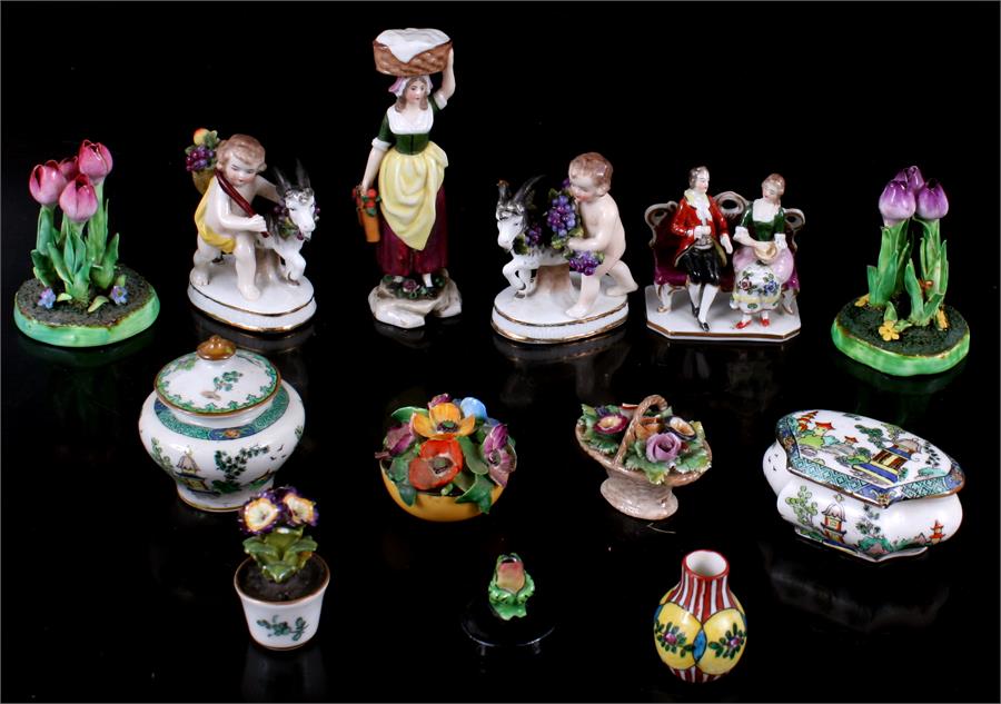 A collection of small china figures and ornaments, including a pair of cherubs with goats, Crown