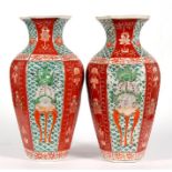 A pair of Japanese vases of hexagonal form, decorated with flowers in enamel colours, 31cm (12.
