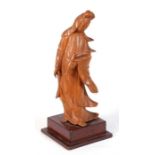 A Chinese boxwood carving in the form of Guan Yin, 15cm (6ins) high