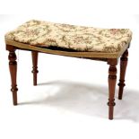 A Victorian mahogany stool with upholstered seat, on turned legs, 62cm (24.5ins) wide.