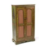 A Kashmiri style painted cupboard with two doors enclosing a single shelf, 67cms (26.5ins) wide.