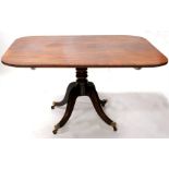 A 19th century rectangular tilt-top breakfast tabel, on turned column and quatrefoil base, 128 by