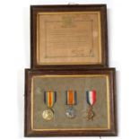 A framed WWI medal trio named to 'Dvr C H Trevett 04211'; together with his framed Discharge