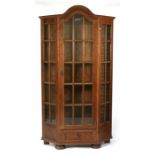 An early 20th century large oak glazed display cabinet, 104cms (41ins) wide.