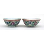 A matched pair of Chinese famille rose bowls, decorated with flowers in enamel colours 17cm (6 3/