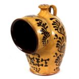 A slipware pottery salt pot, 24cm (9.5ins) high. Condition Report Good condition with no damage or
