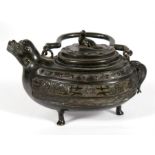 A Japanese bronze teapot of archaic form with dragon spout, 11cms (4.25ins) high.