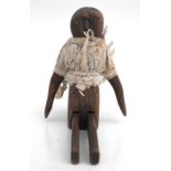 A folk art articulated wooden doll, 27cm (10.5ins) high