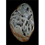 A Chinese jade like boulder carved with figures in a landscape, 22 by 14cms (8.5 by 5.5ins).