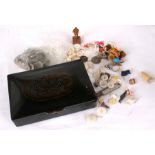 A Chinese tortoiseshell box with carved dragon to the lid, containing buttons and other items.
