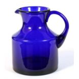 A 19th century Bristol blue water jug, 15cms (6ins) high.