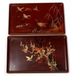 Two Japanese rectangular lacquer trays decorated with gilded birds, with gilded two character seal