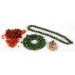 A Chinese jade like bead necklace; a jade like pendant; a pierced jade like disc; and a quantity