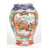 A large 19th century Japanese vase, decorated with birds, figures and flowers in enamel colours,