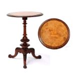 A Victorian walnut tripod table, the top inlaid with a hunting scene depicting a warrior on