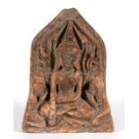 A Thai terracotta votive plaque depicting two figures kneeling before a deity, 14cms (5.5ins)