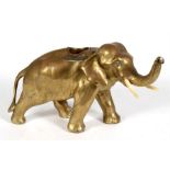A Victorian brass table top match striker in the form of an elephant, 15cms (6ins) high.
