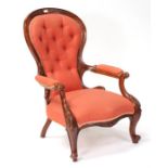 A Victorian walnut and upholstered button backed chair.