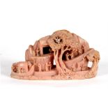 A Chinese pink soapstone carving of figures in a landscape, 22cms (8.5ins) wide. Condition Report