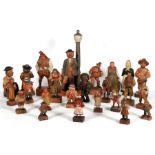 A collection of carved wooden Anri figures, to include a musical corkscrew.