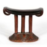 An African tribal hardwood neck rest, 13cms (5ins) high.