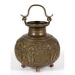 An Indian bronze water pot, decorated in relief with figures and mythical beasts and having a
