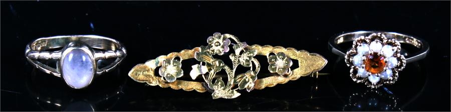 Two 9ct gold gem set rings; together with a 9ct gold floral bar brooch (3).