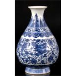 A Chinese blue & white baluster vase decorated with dragons amongst foliate scrolls, 19cms (7.