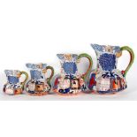 A set of four graduated Davenport Hydra jugs of octagonal form, with snake handles, the largest