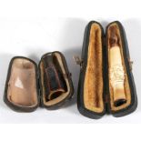 A Victorian Meerschaum cheroot holder, boxed, 9.5cms (3.75ins) long; together with a cigar holder
