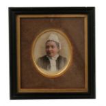 A portrait miniature of a lady in a lace bonnet and collar, in black frame, 19.5 by 18cm (7.75 by