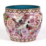 A large Chinese cloisonne jardinaire decorated with cranes in flight, 35cms (13.75ins) diameter.