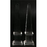 A pair of glass obelisks, 20cm (8ins) high.