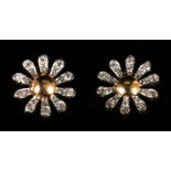 A pair of 18ct gold diamond daisy earrings. Condition Report Very good condition