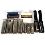 A quantity of harmonicas, to include Echo and Hohner examples.