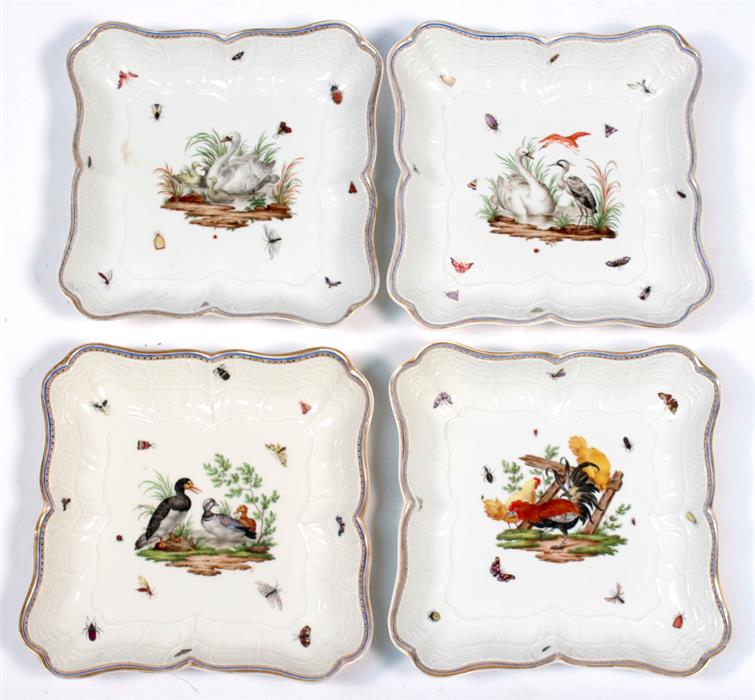A set of four Meissen dishes of shaped form decorated birds and insects within an embossed border.