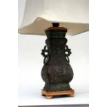 A Chinese bronze vase form table lamp, 35cms (13.75ins) high.