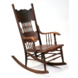 A 19th century spindle back rocking chair.