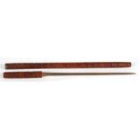 A Military style swagger sword stick, the wooded sheaf cared with a repeating spiral pattern,