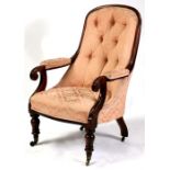 A 19th century mahogany button backed chair on turned front supports.