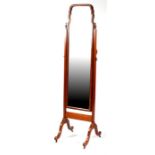 A walnut cheval mirror.