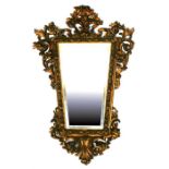 A 19th century giltwood rococco style wall mirror, 78 by 121cms (30.7 by 47.5ins).