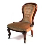 A Victorian mahogany button backed chair with cabriole front legs.