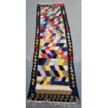 A Shiraz Kelim runner with repeat geometric design on beige ground, 270 by 83cms (106 by 32.5ins).