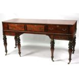 A 19th century mahogany sideboard converted from a spinette, standing on six ring turned legs, 171cm