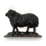 A Victorian cast iron doorstop in the form of a ram, 25.5cms (10ins) wide.