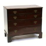 An early 19th mahogany chest of small proportion, with four long graduated drawers, on bracket feet,